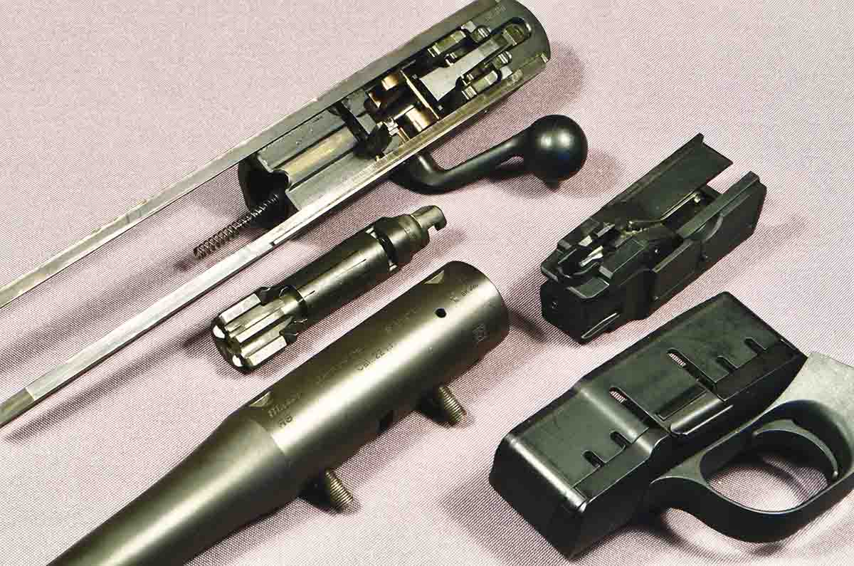 The component parts and where they fit. Every R8 has a bolt carrier (bolt assembly) and trigger assembly (termed the “spare magazine” by Blaser, for whatever reason). Each optional caliber has its own bolt head and magazine insert, as well as a barrel.